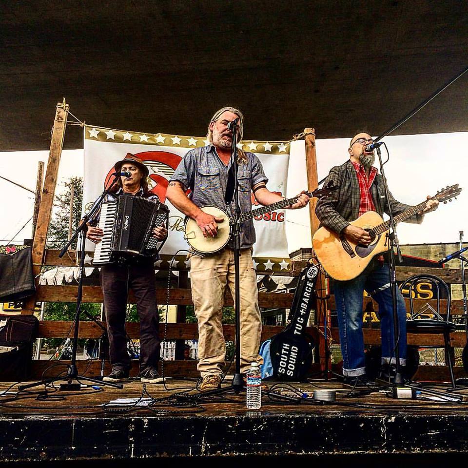 South Sound Tug & Barge live at the Georgetown Carnival Festival, summer 2016.  (l. to r. Charley Rowan, Steve Duda, Scott M.X. Turner)